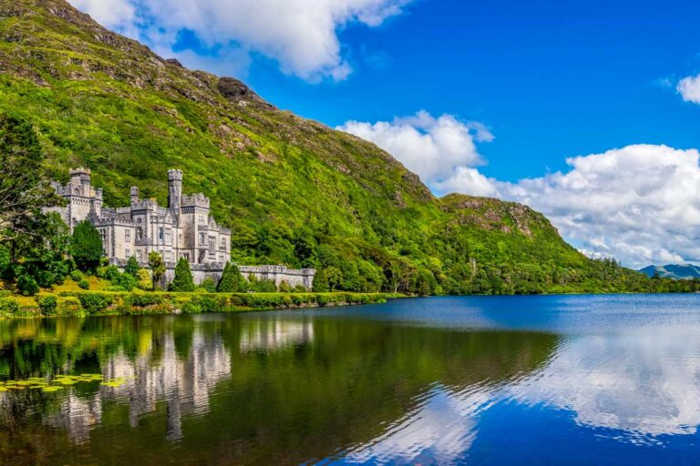 Kylemore Abbey seen on a sunny day on a tour from Galway Ireland
