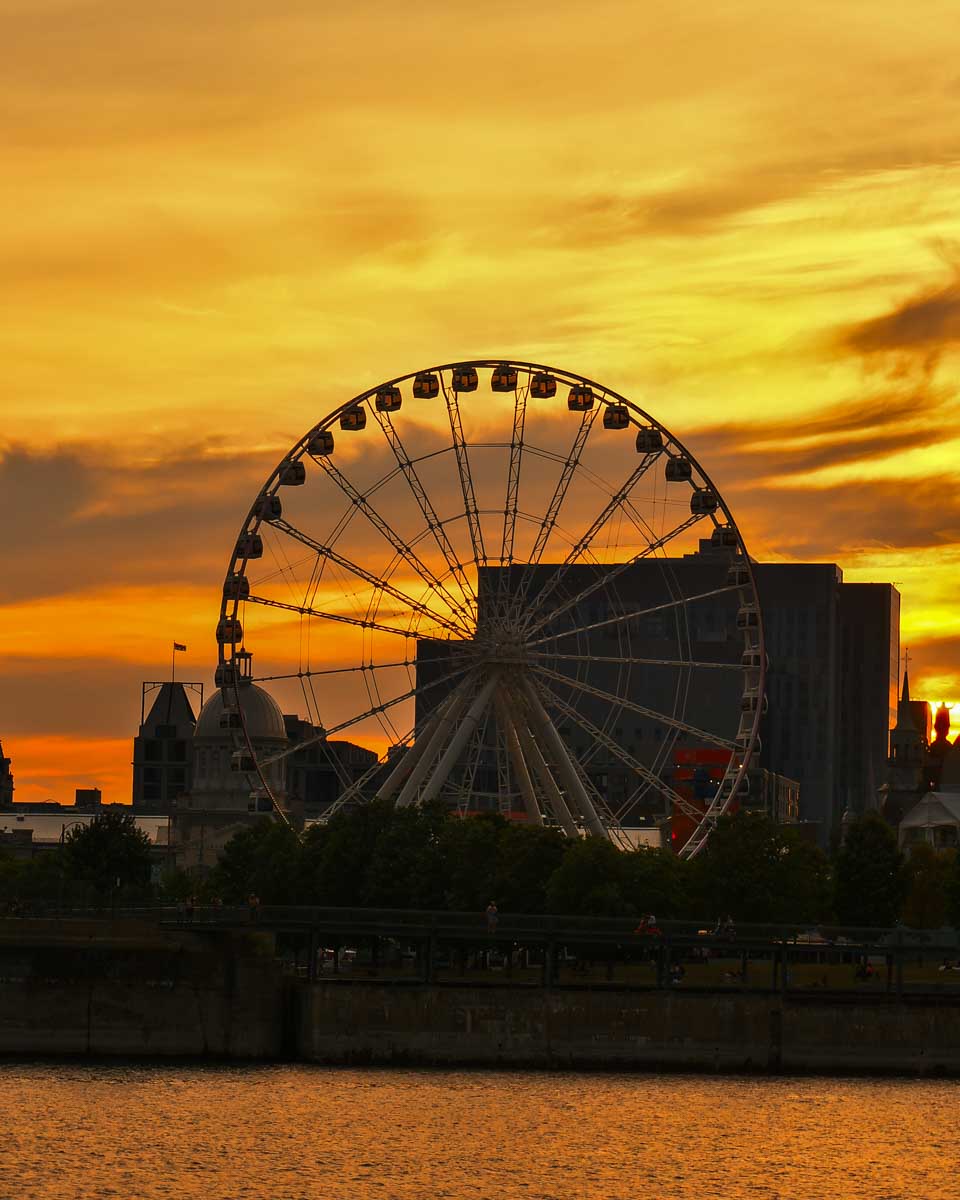 Montreal ferris wheel seen at sunset on a river cruise in Montreal Quebec