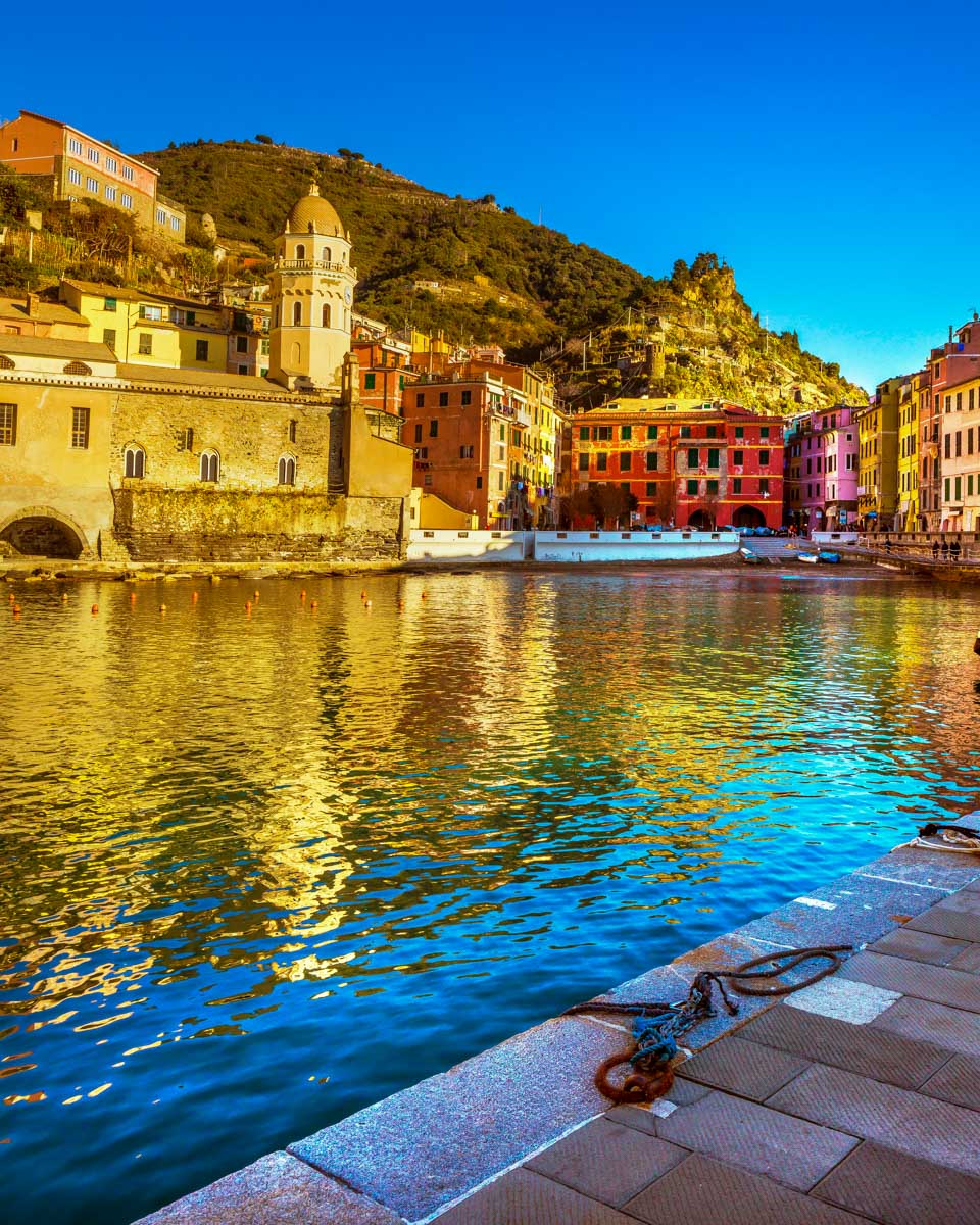 The-village-of-Vernazza-seen-on-a-cruise-of-Cinque-Terre-from-Manarola-Italy