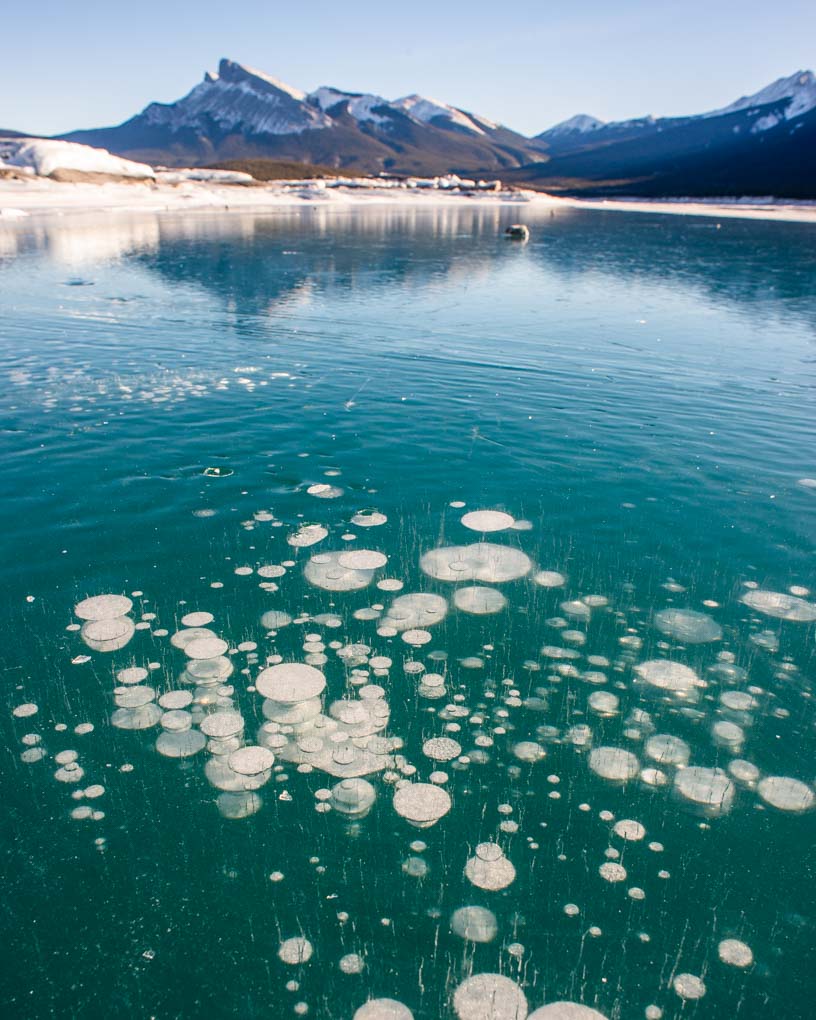 methane bubbles at Abraham Lake when its frozen over in the winter on a tour of the icefields parkway in Alberta Canada