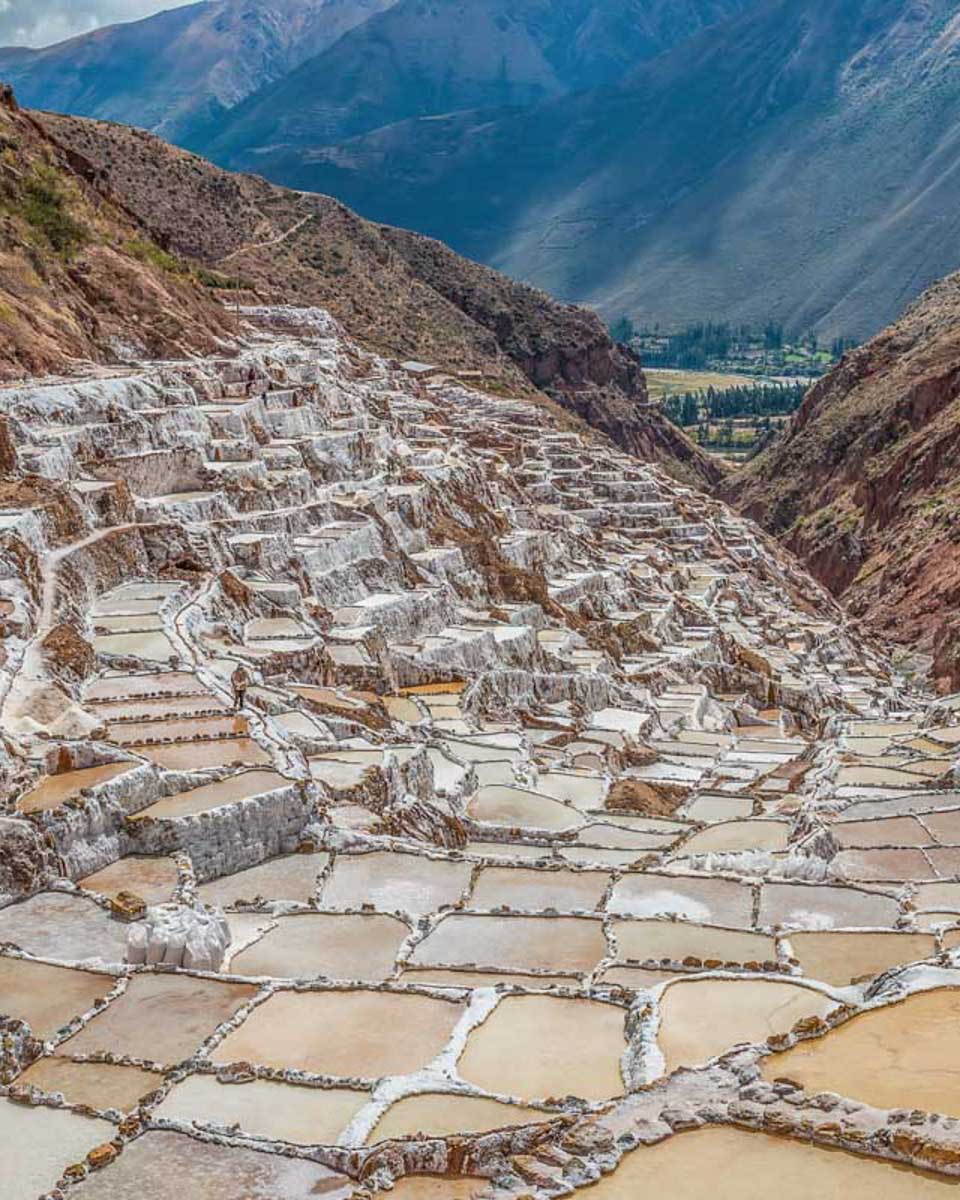 A-panoramic-view-of-the-Salineras-de-Maras-salt-beds-in-Peru-on a tour from Cusco