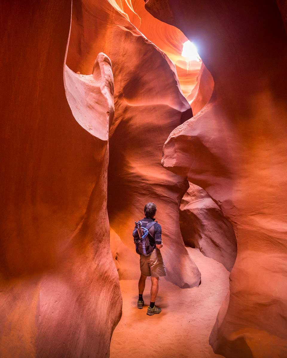 A person walks through Lower Antelope Canyon on a tour from Page Arizona