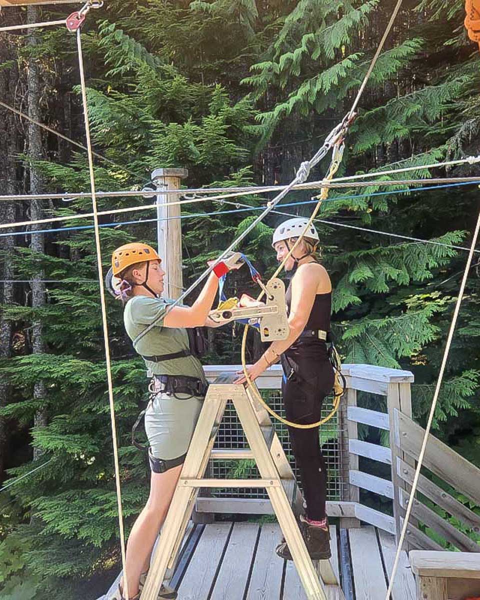 Bailey-getting-unhitched-from-the-zipline-after-coming-down-whistler-canada-sasquatch-zipline