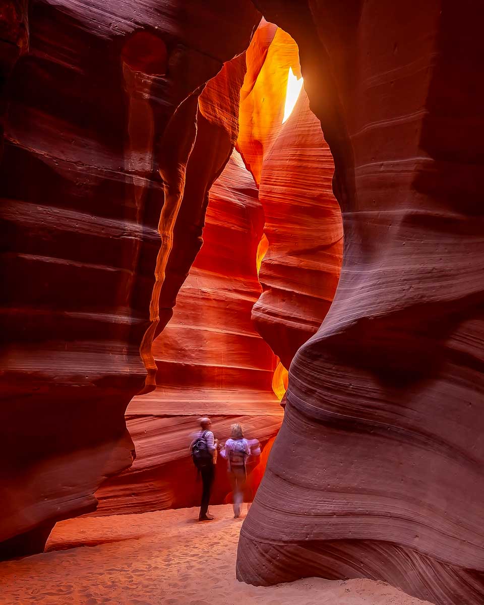 People walk in Upper Antelope Canyon on a tour from Page Arizona
