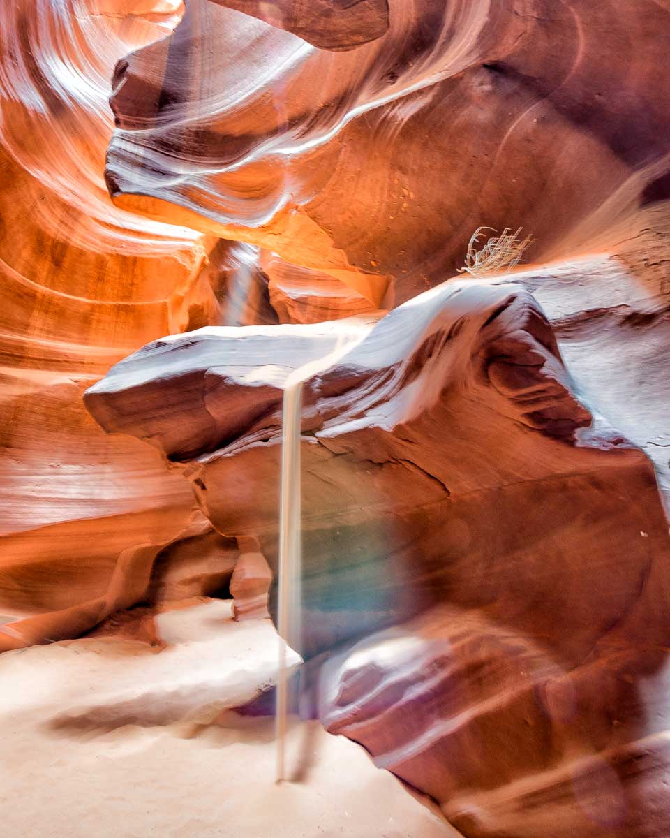 Sand falling of of a rock in Upper Antelope Canyon on a tour from Page Arizona
