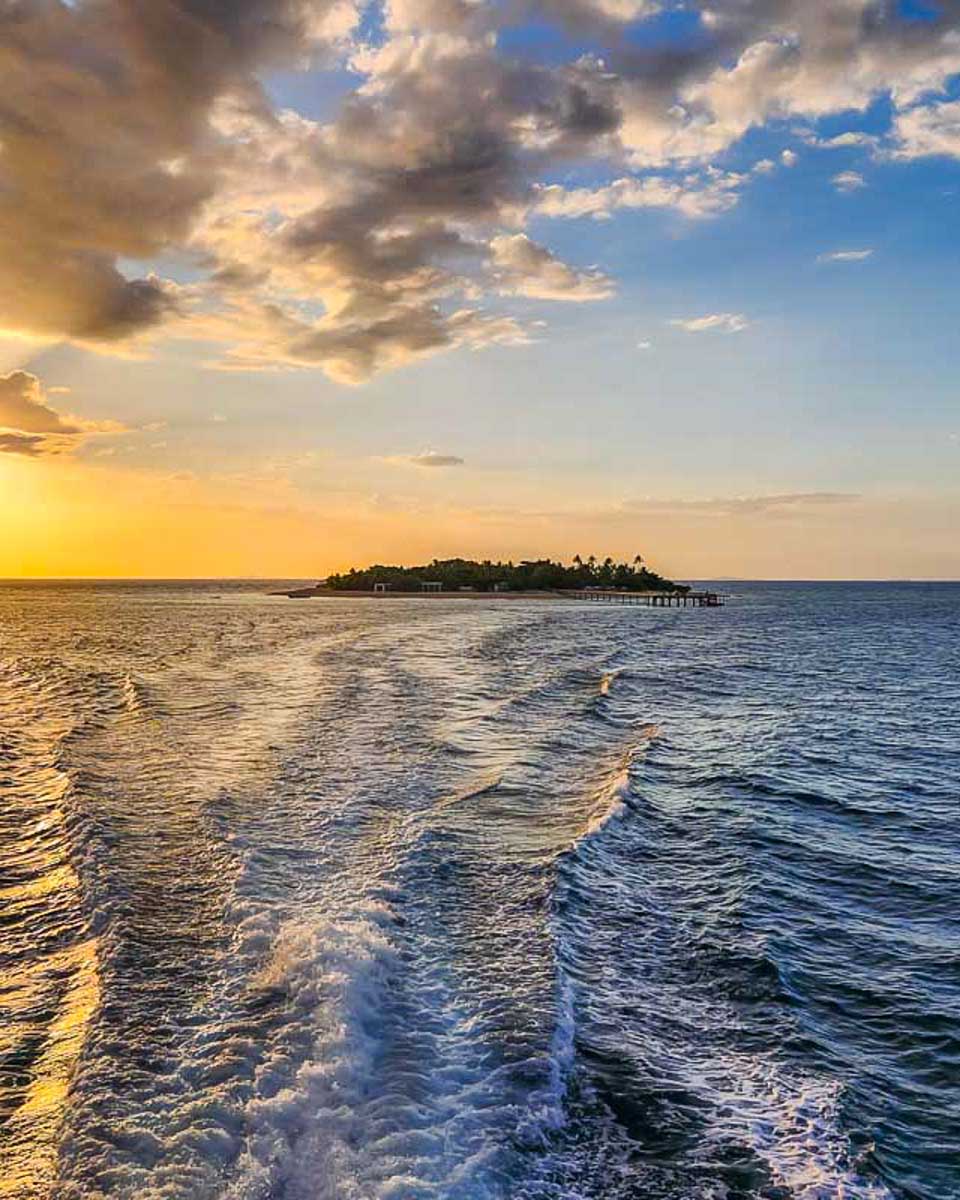 Sunsets-behind-an-island-on-a-sunset-and-cultural-cruise-in-Fiji