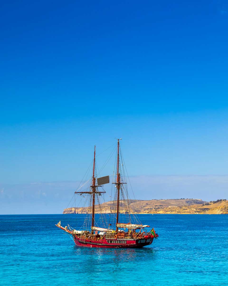 The Blue Lagoon and a boat seen on a boat tour from Malta