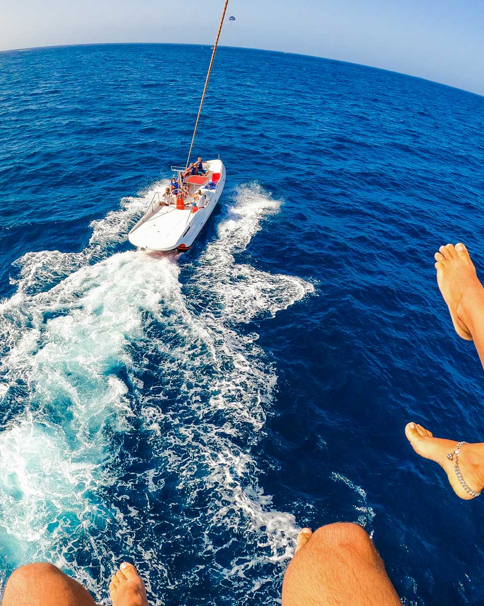 View-of-two-people-parasailing-over-the-ocean-near Malta