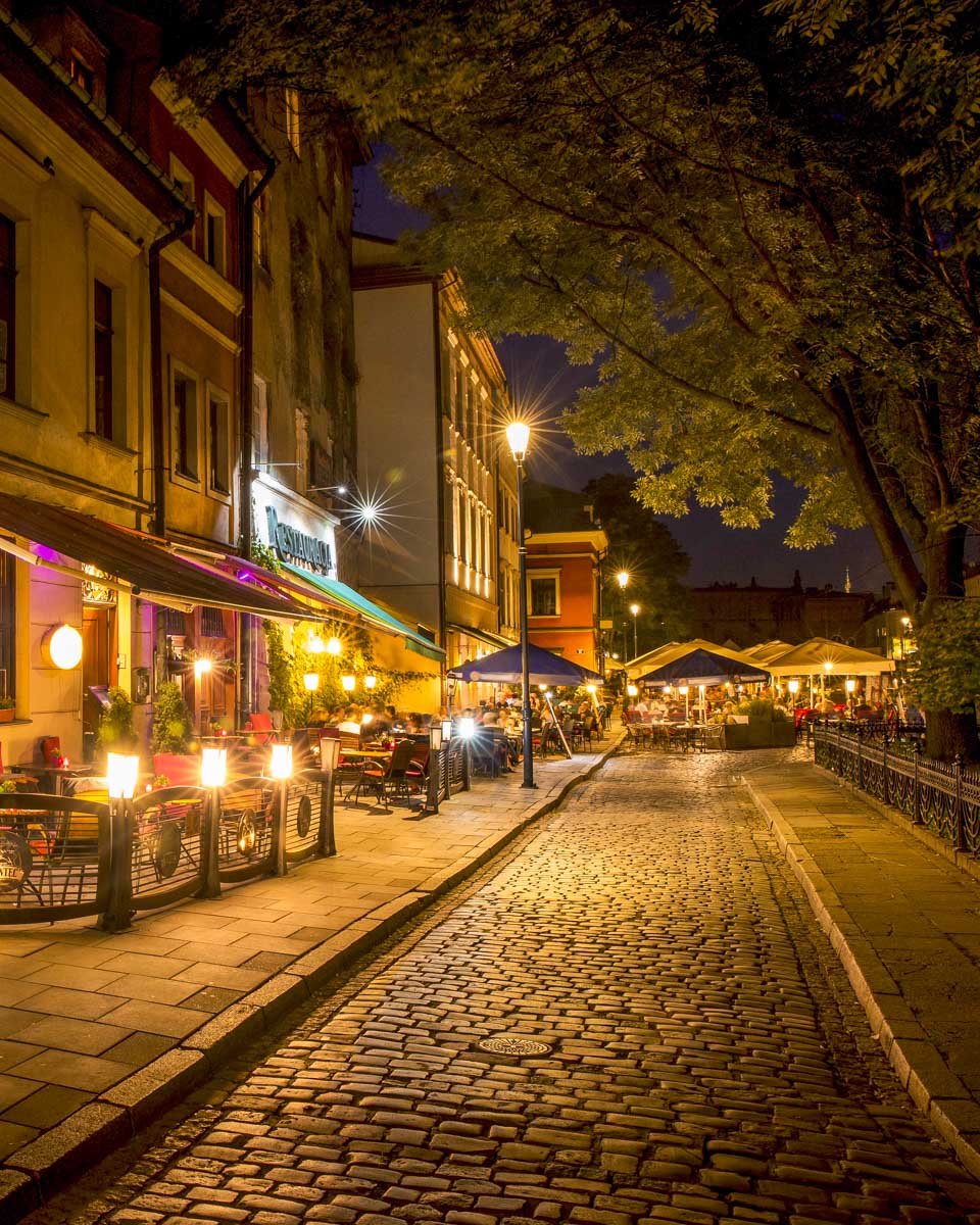 Walking through Kazimierz Jewish Quarter at night in Krakow Poland