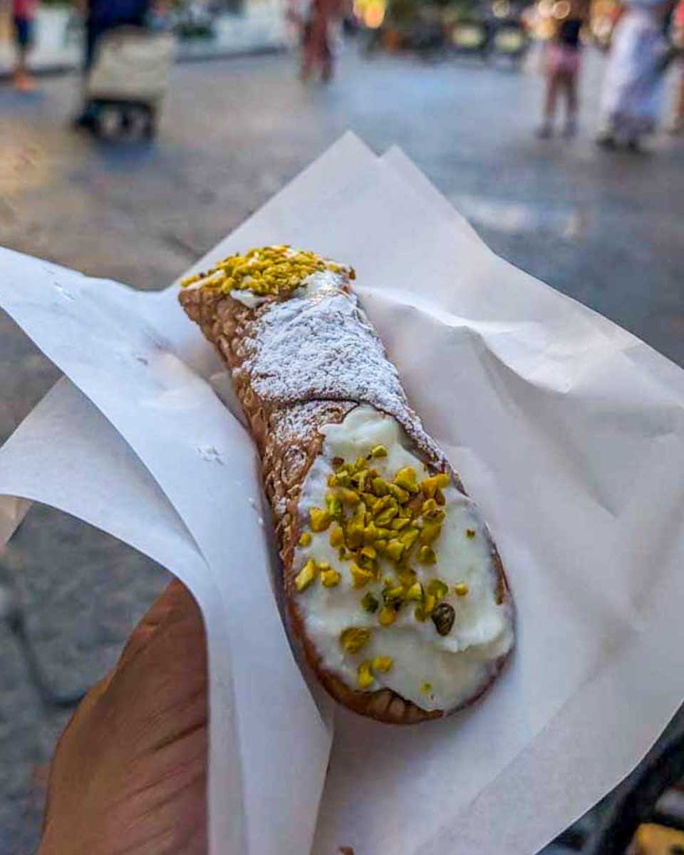 A-cannoli-eaten-on-a-food-tour-in Catania Sicily