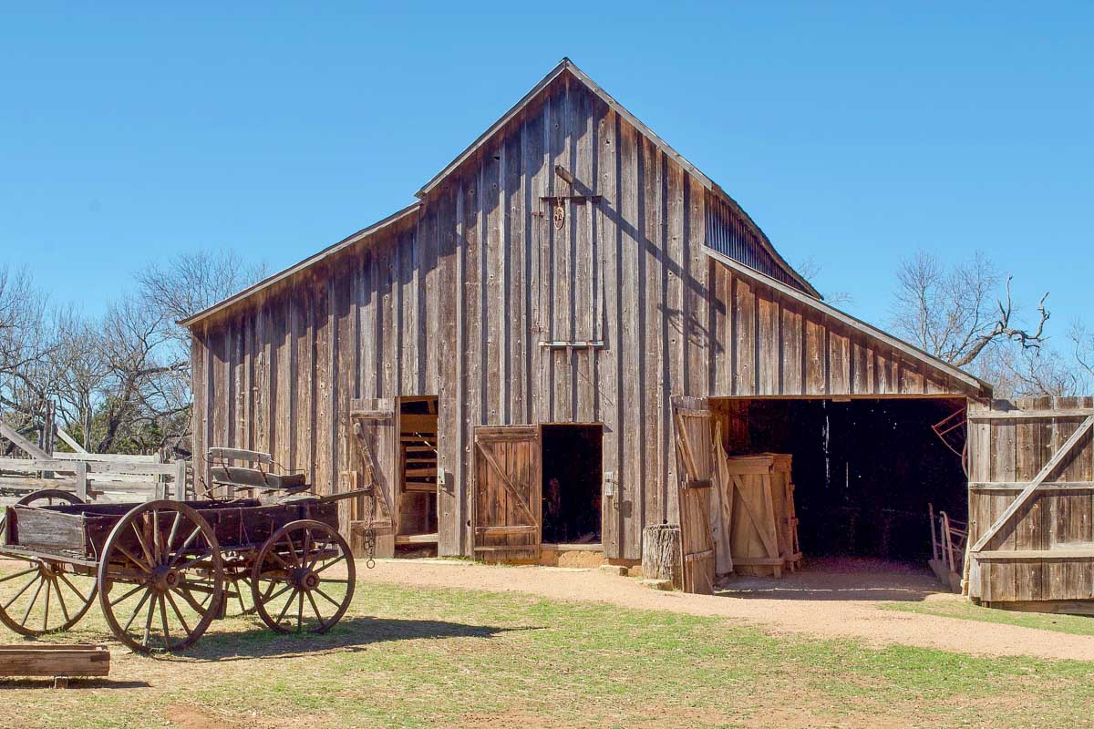 A wood barn and wagon at Lyndon B. Johnson State Park seen on a tour from San Antonio Texas