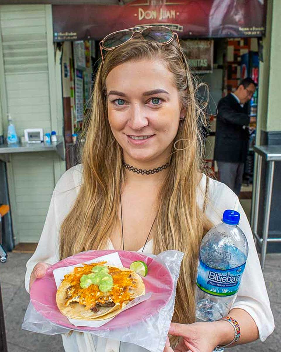 Bailey-with-a-shrimp-taco-in Tulum Mexico