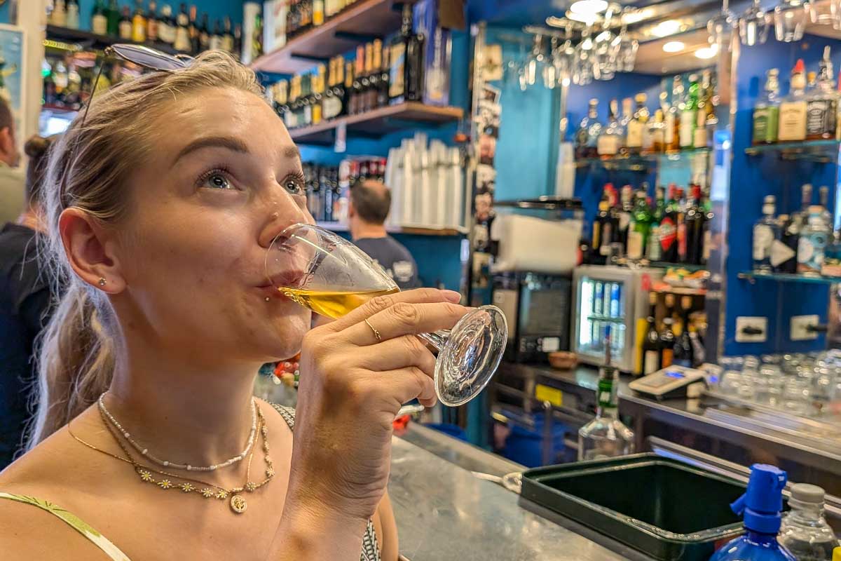 San Sebastian Spain Bailey drinks wine on a food tour