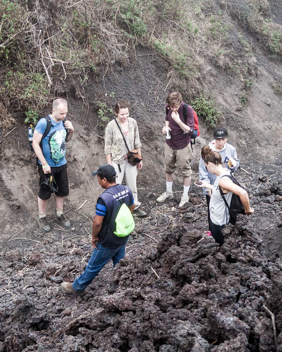 Tourists hike pacaya volcano from Antigua Guatemala