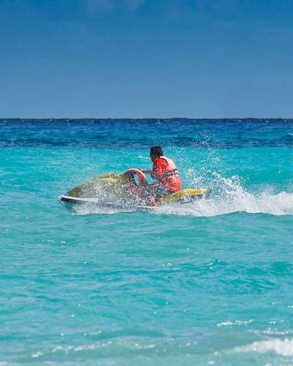 A-person-rides-a-jet-ski-in-Turks-and-Caicos