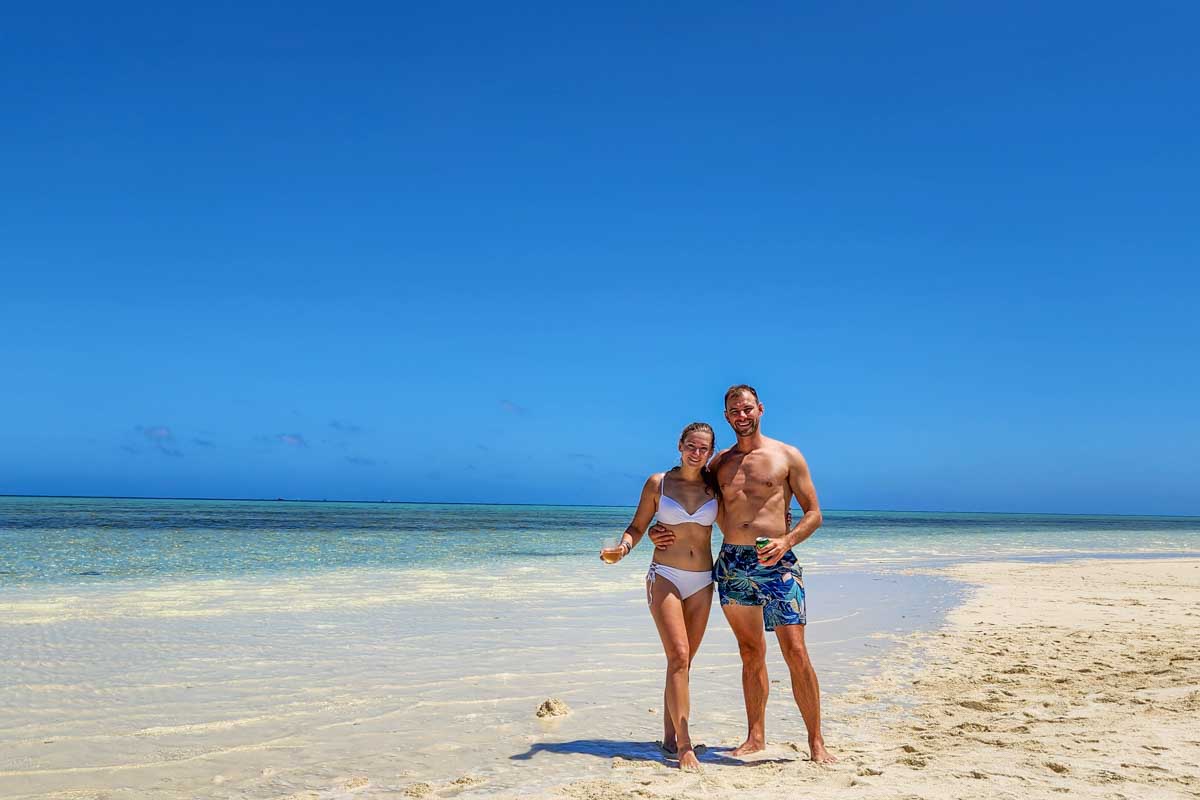 Bailey-and-Daniel-pose-for-a-photo-on-the-beach-in Bermuda