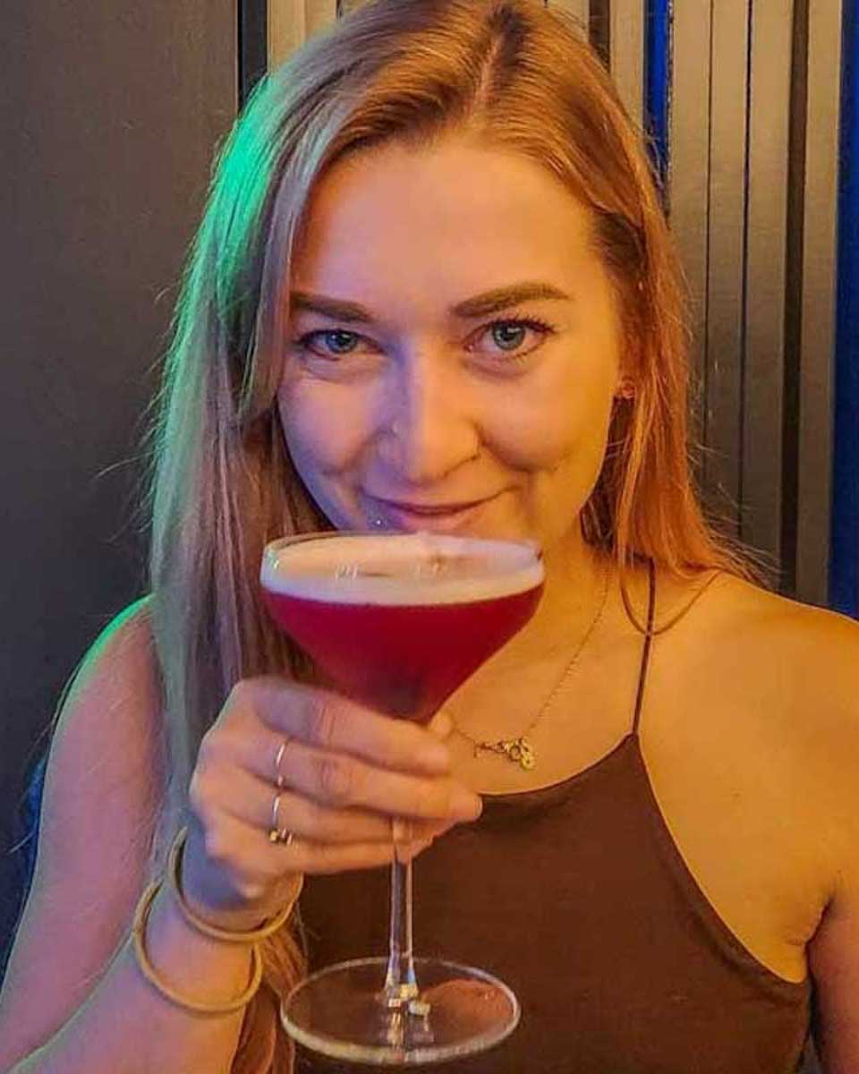 Bailey-enjoys a drink in Bermuda on a food tour