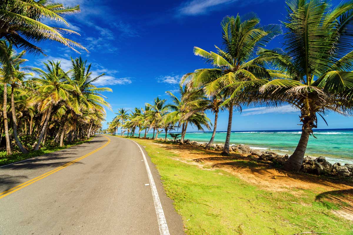 Driving on a road beside the beach in the Caribbean