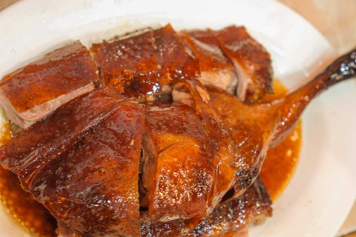 Grilled duck eaten for dinner at a restaurant in Beijing China