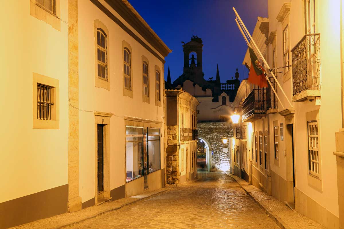Street at night in the old town of Faro, Portugal