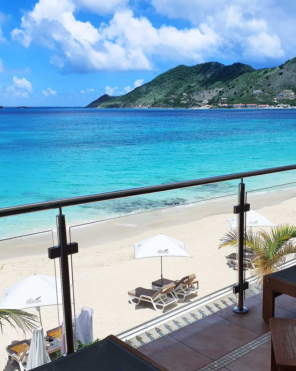 Balcony overlooking the beach and ocean at Bleu Emeraude Hotel