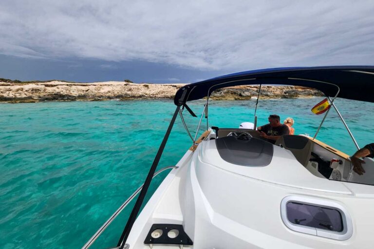 A boat and blue green water seen on a boat tour from Ibiza Spain (2)