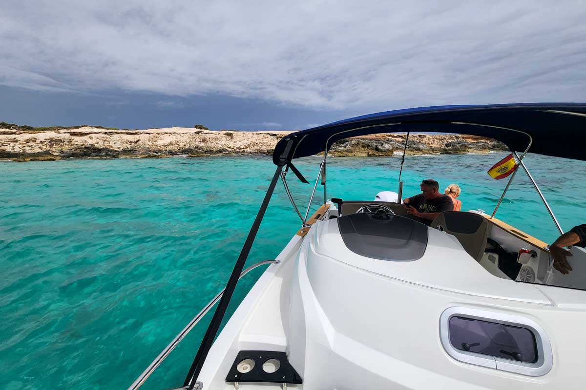 A boat and blue green water seen on a boat tour from Ibiza Spain (2)