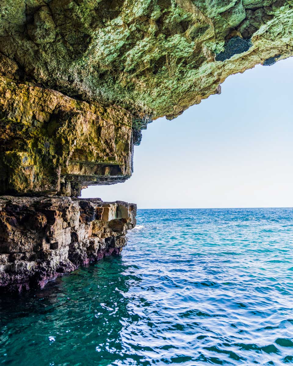 Caves seen on the coast of Polignano a Mare on a tour from Puglia Italy