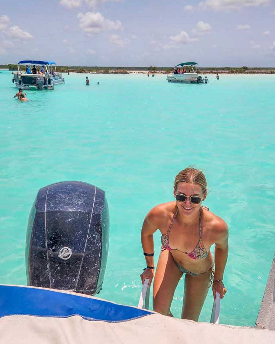 Bailey-climbs-onto-the-boat-in-Bacalar-Lagoon near Costa Maya Mexico