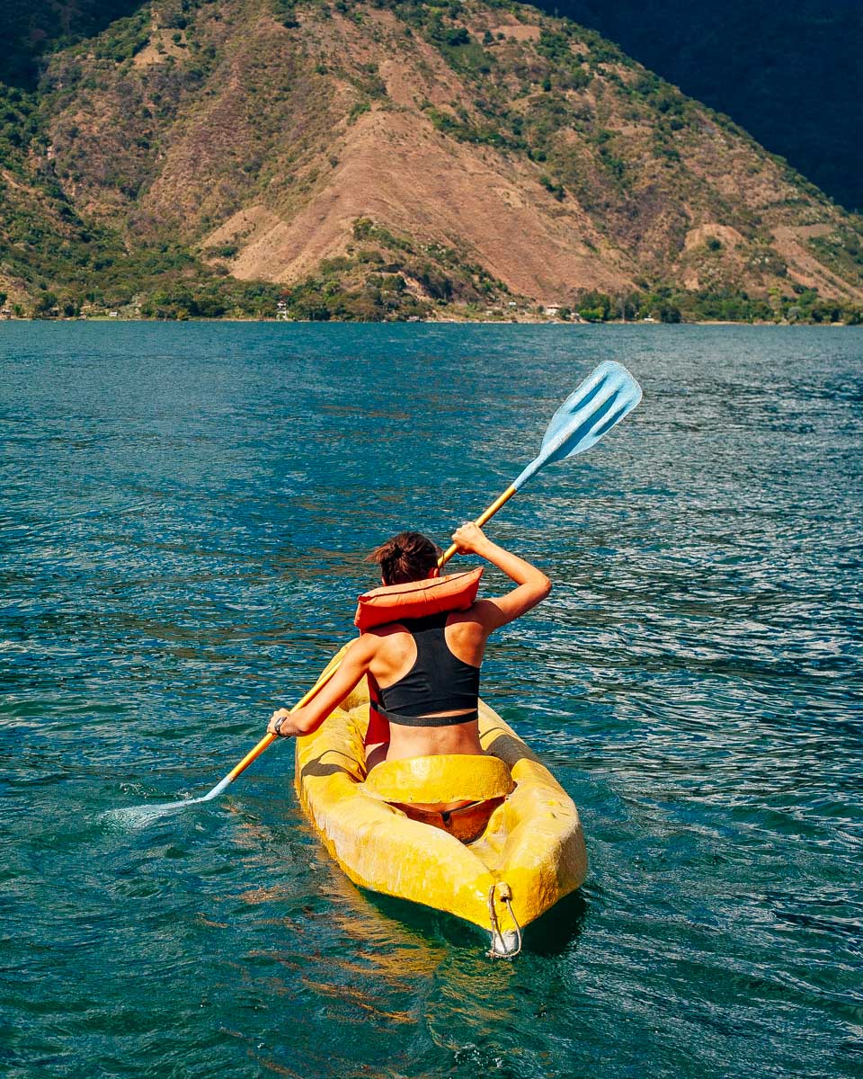 A person kayaks on Lake Atitlan Guatemala
