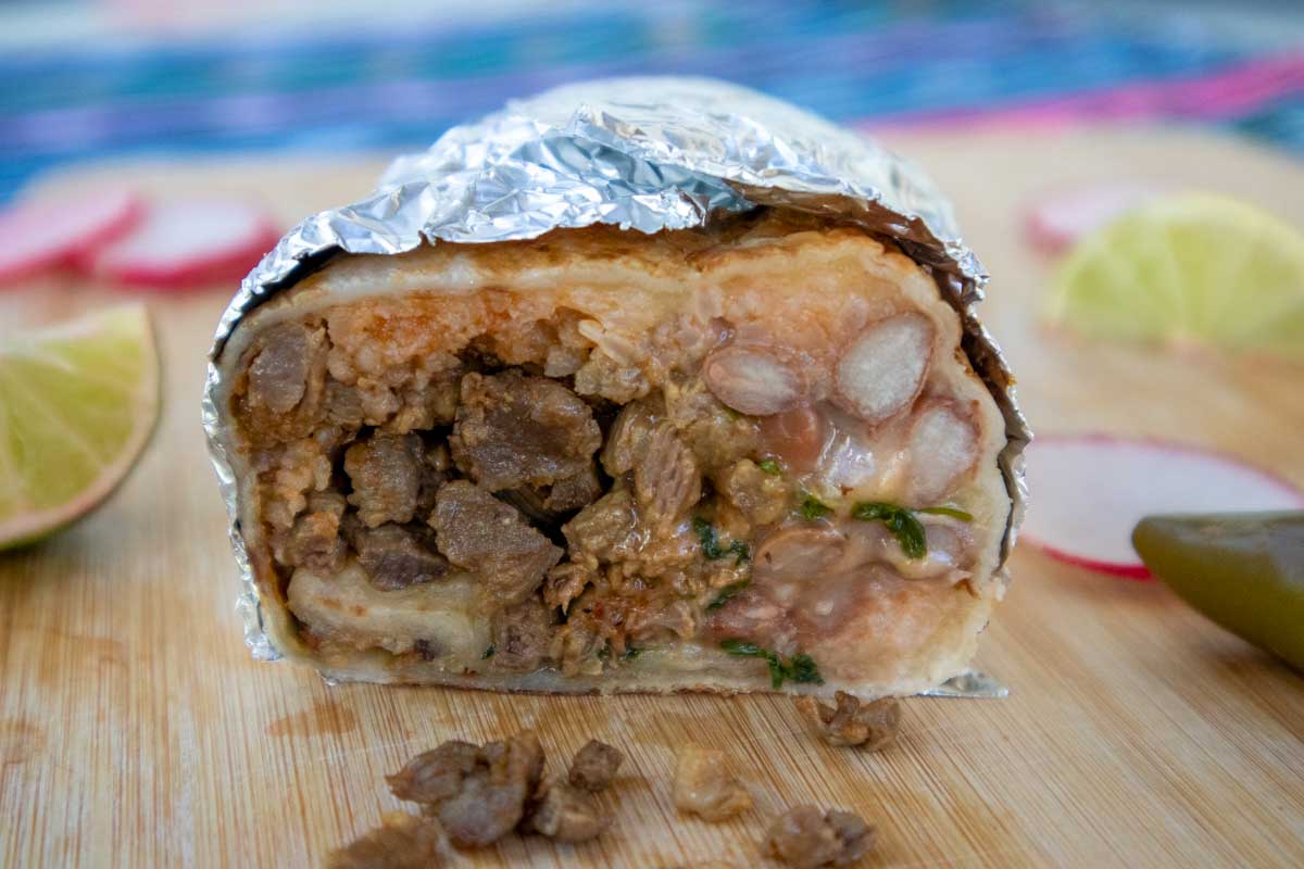 Burrito cut in half wrapped in foil eaten in San Miguel de Allende Mexico