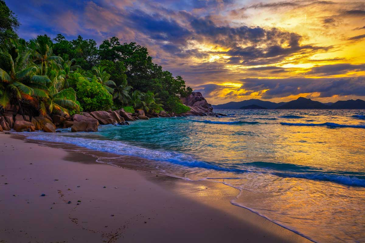 Colorful sunset over Anse Severe Beach at the La Digue Seychelles