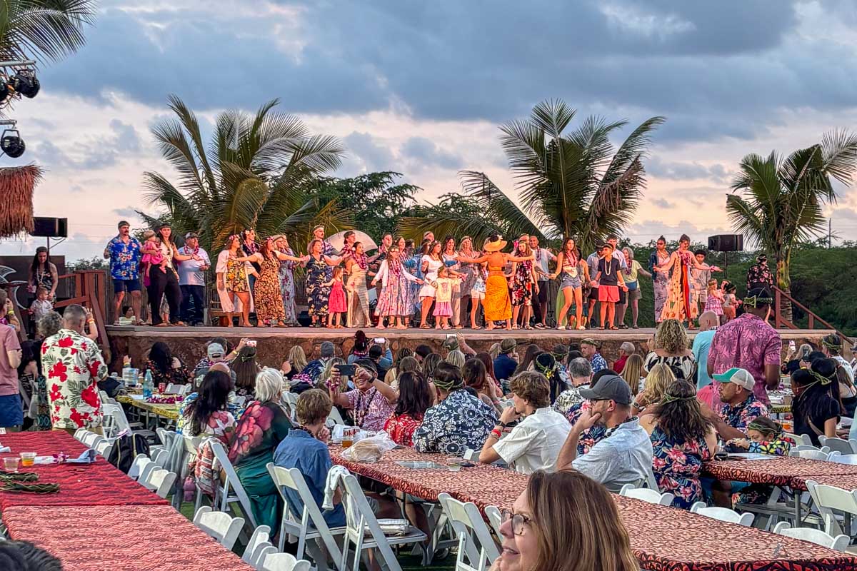 People on stage at a luau on Oahu Hawaii